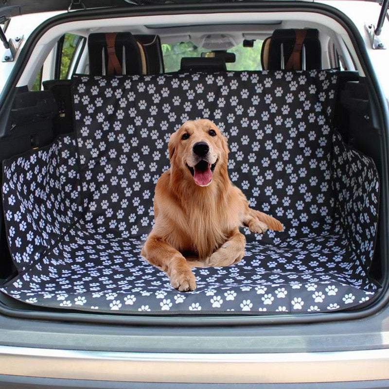 A Dog Sitting On The Waterproof Dog Trunk Mat With Paw Prints
