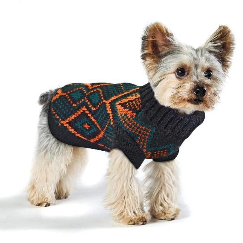 Dog wearing a Toggy Doggy stretchy dog sweater that has a pretty patterned design of bluish-black and orange alternately.
