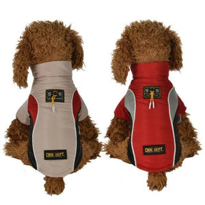 2 Dogs Wearing A Red And Beige All Weather Dog Vest