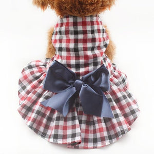 A Dog Wearing The Plaid Dog Dress With Bow