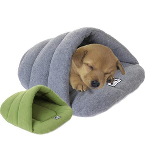 A Puppy Sleeping In The Gray Slipper Dog Sleeping Bag